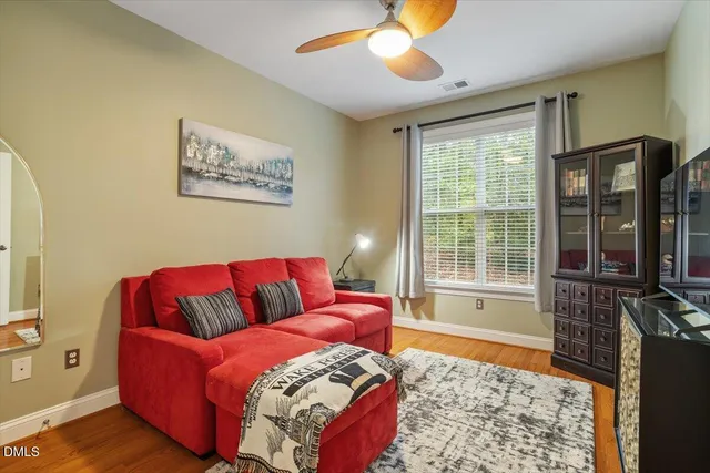 a bathroom with a granite countertop sink toilet mirror and a shower