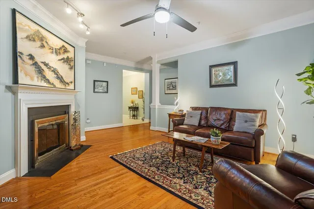a living room with a flat screen tv and a fireplace