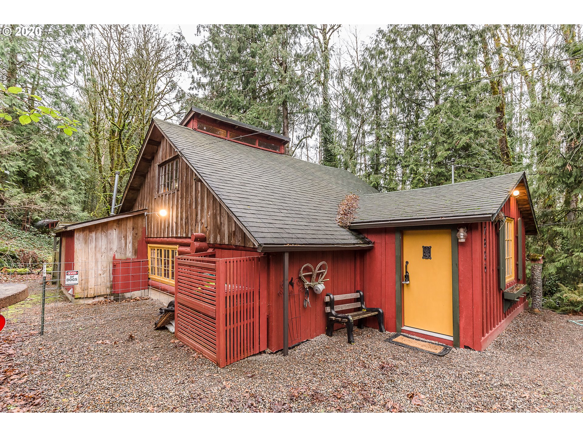 7825 Southeast Barbara Welch Road Portland, OR 97236 - Photo 1 of 20 a view of a barn in the backyard with large trees