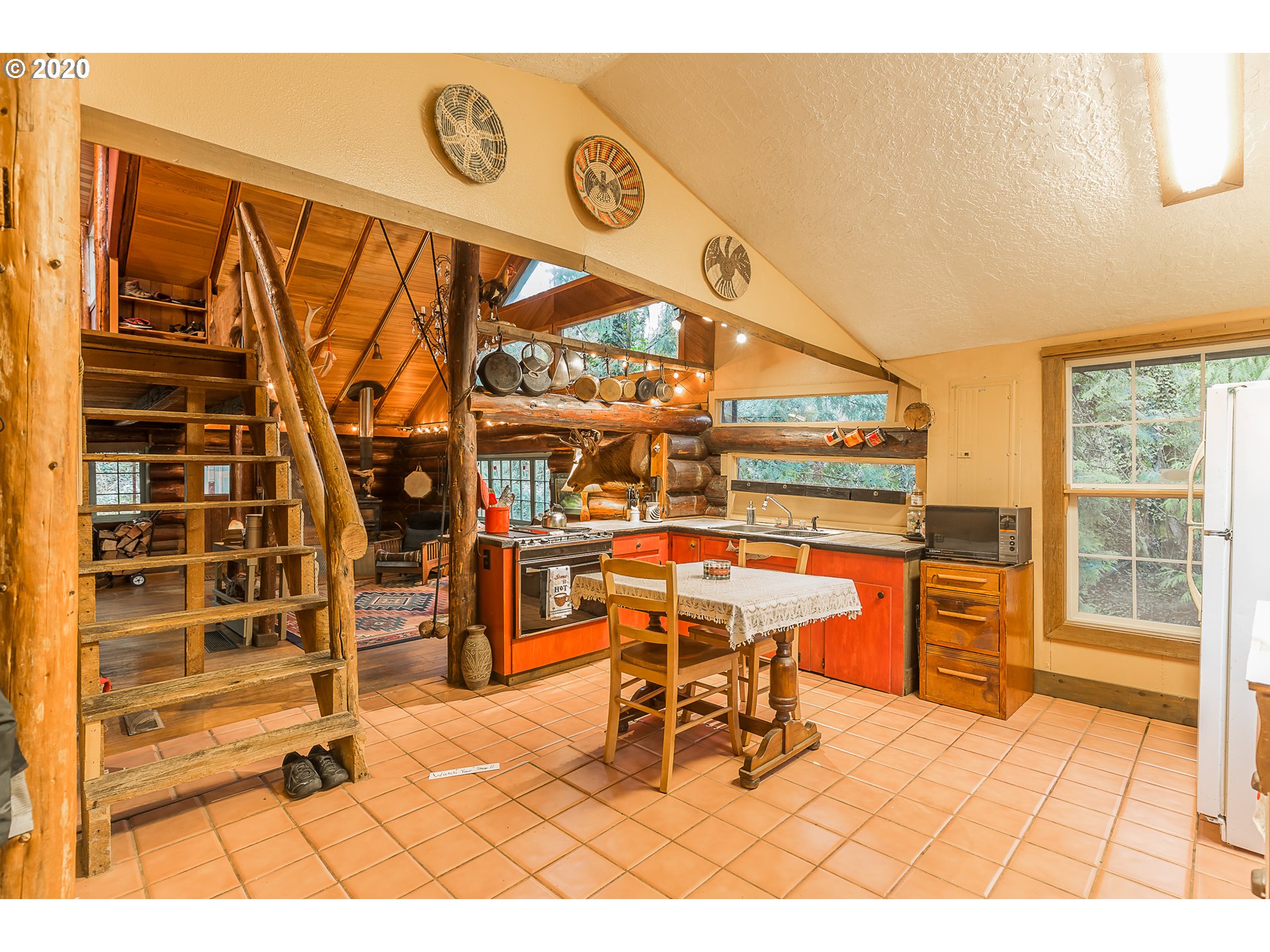 7825 Southeast Barbara Welch Road Portland, OR 97236 - Photo 3 of 20 a dining room with a table and chairs