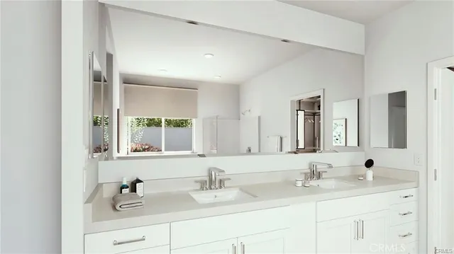 a bathroom with double sink and a mirror