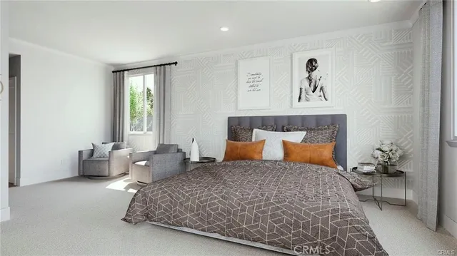 a bedroom with a large bed and a couch