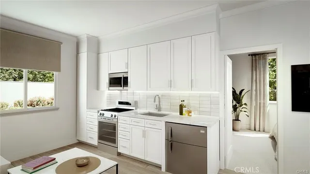 a kitchen with a sink stove and refrigerator