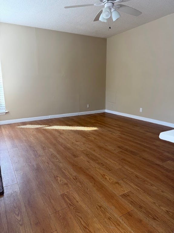 1000 West 26th Street, Unit 104 Austin, TX 78705 - Photo 1 of 8 a view of an empty room with wooden floor