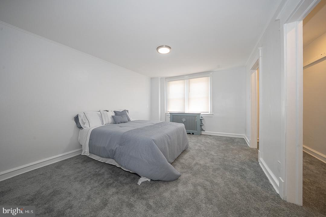 426 Hampden Road Upper Darby, PA 19082 - Photo 5 of 31 a spacious bedroom with a bed and window