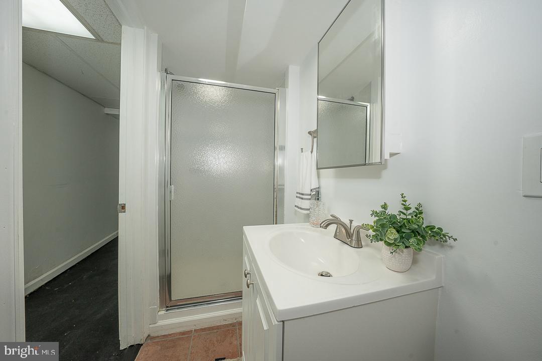 426 Hampden Road Upper Darby, PA 19082 - Photo 8 of 31 a bathroom with a sink a toilet and mirror