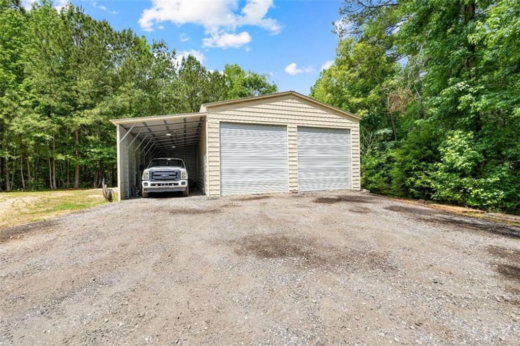 128 Byrom Road Senoia, GA 30276 - Photo 67 of 83 a view of a house with a yard and large tree