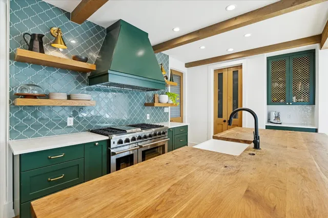 a kitchen with a stove and a refrigerator