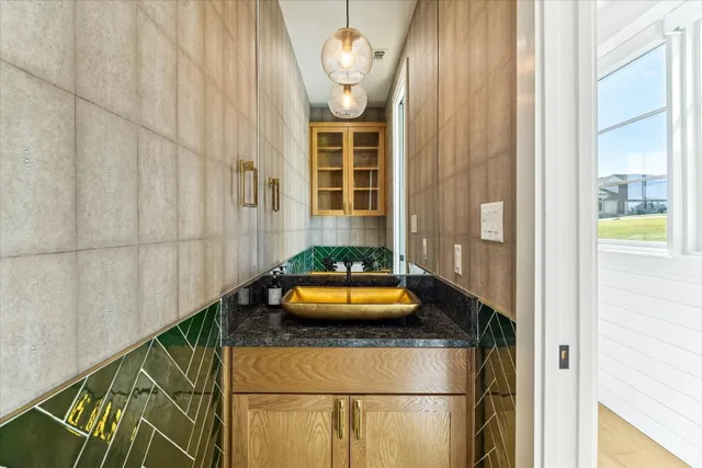 a bathroom with a sink and a window