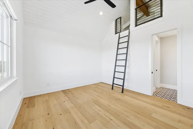 a utility room with cabinets washer and dryer
