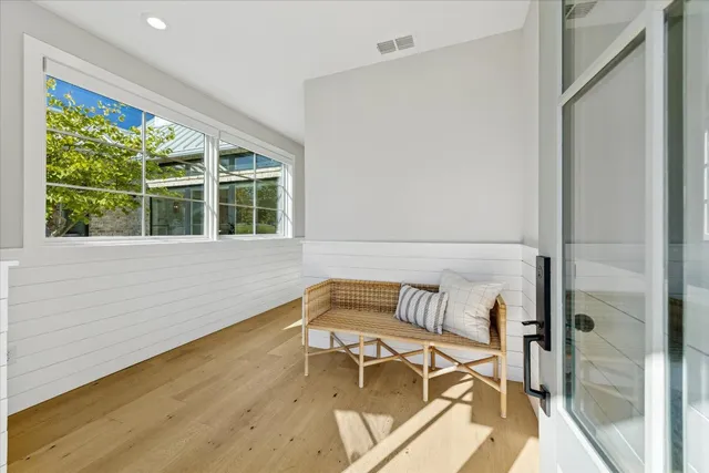 a living room with a couch and a large window