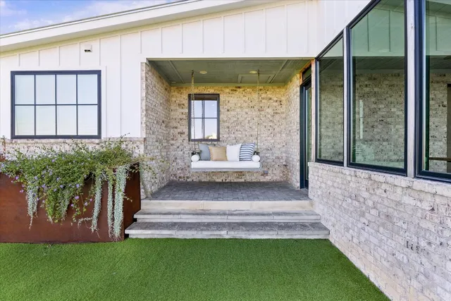 aerial view of a house with a yard