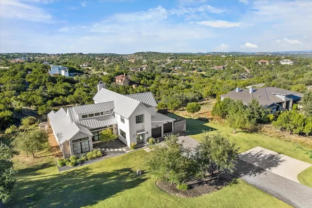a picture of a room with furniture and refrigerator