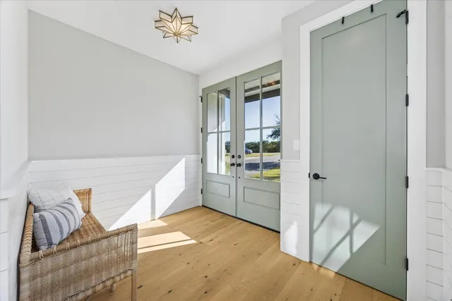 a room with a couch and a chandelier