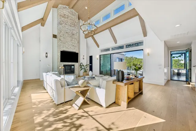a living room with fireplace furniture and a flat screen tv