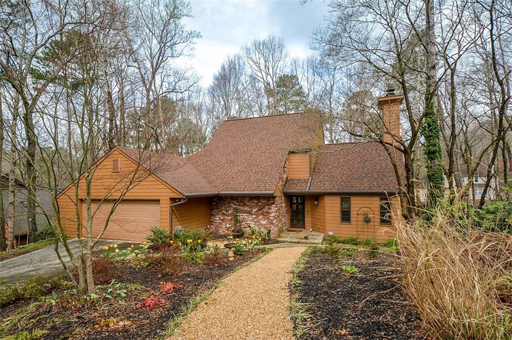4034 Dunbarton Way Roswell, GA 30075 - Photo 1 of 1 a front view of a house with garden