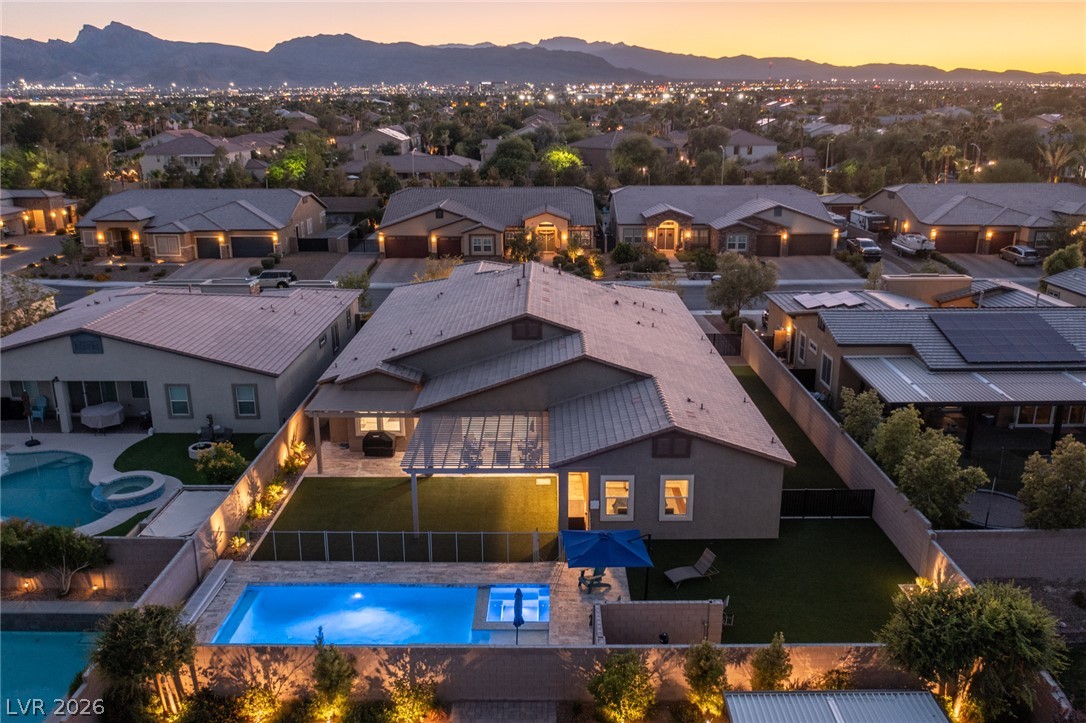 7036 Arabian Ridge Street Las Vegas, NV 89131 - Photo 3 of 64 Single Story Stunner with sparkling pool, spa, and permanent exterior lighting
allowing you to customize colors, patterns, and schedules for holidays, game days, or everyday ambiance.