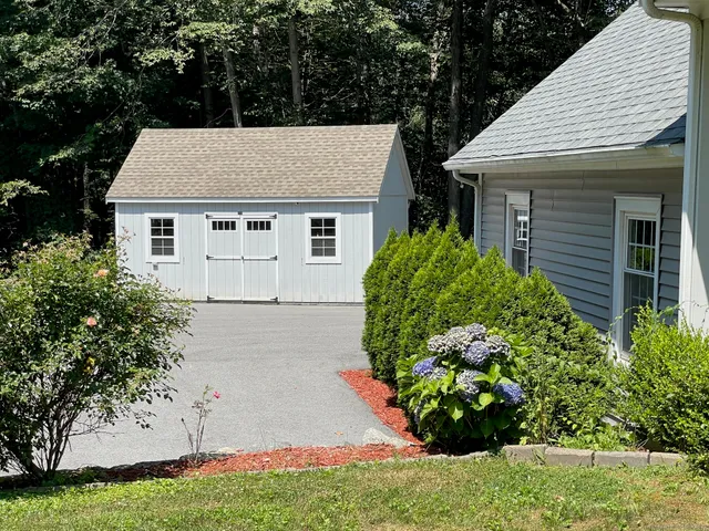 a view of a lake with a house in the background