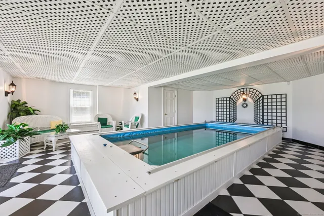 a view of a swimming pool and lounge chair