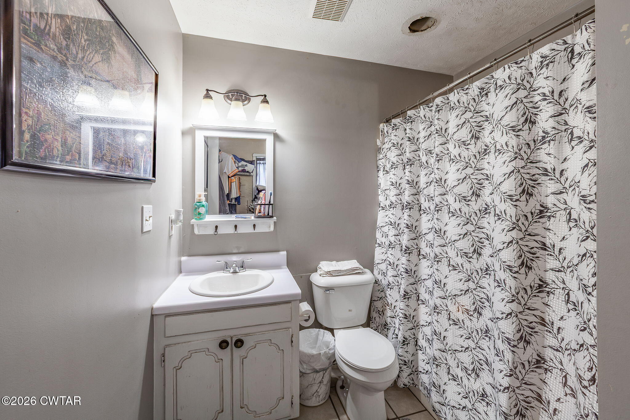 56 Ellendale Place Jackson, TN 38305 - Photo 15 of 23 a bathroom with a sink and a toilet
