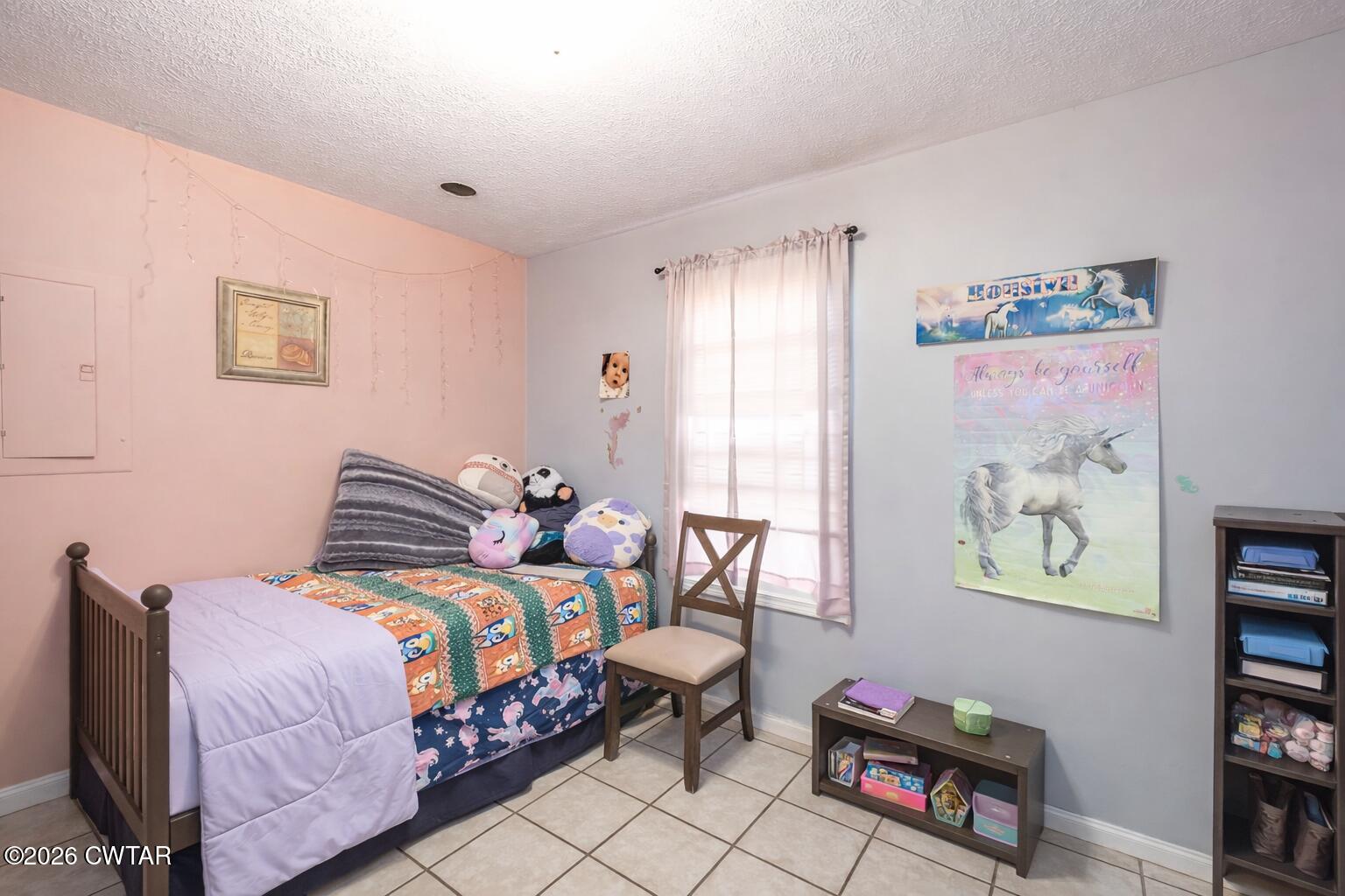 56 Ellendale Place Jackson, TN 38305 - Photo 20 of 23 a bedroom with a bed a wall painting and a window