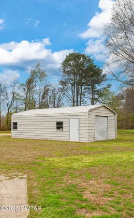 a kitchen with a sink a refrigerator cabinets and a counter top space