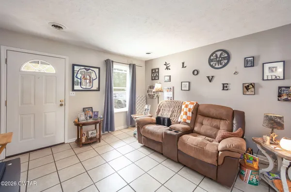 a living room with furniture and a window