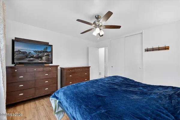 a bedroom with a bed and a dresser