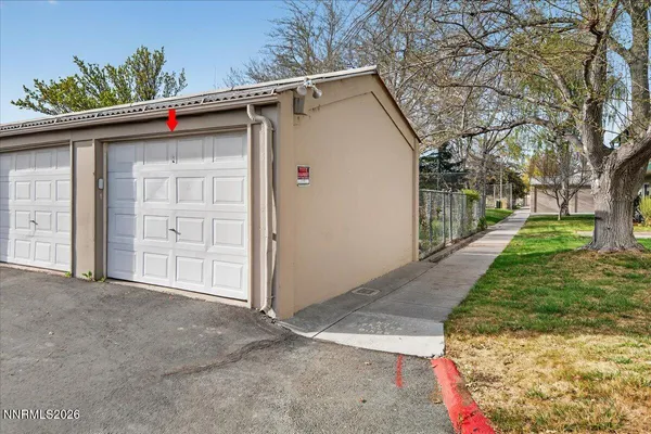 a utility room with cabinets washer and dryer