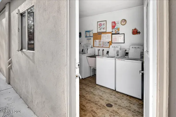 an aerial view of residential houses and outdoor space