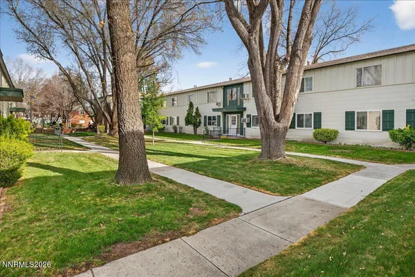 a view of a house with a yard