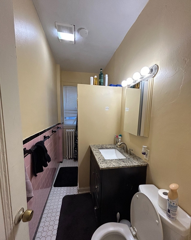 17 Hillside Street, Unit 1 Boston, MA 02120 - Photo 4 of 8 a bathroom with a sink and a mirror