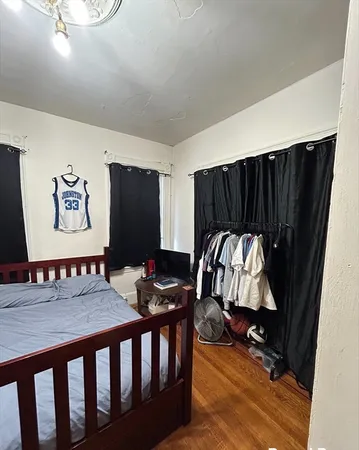 a bedroom with furniture and a window