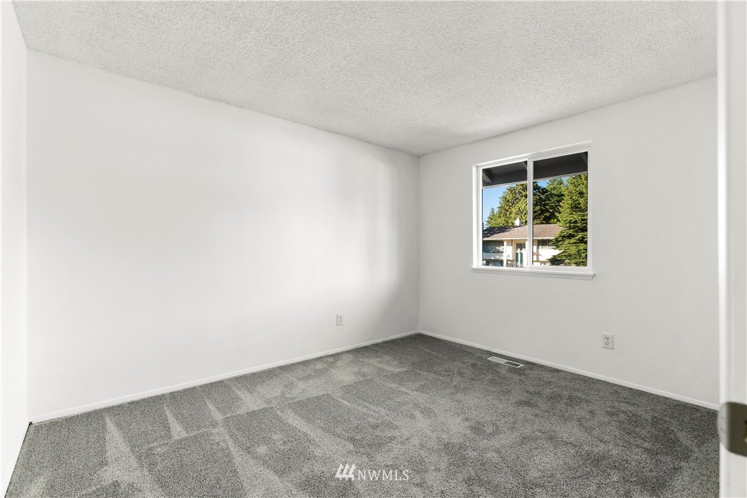 17335 159th Avenue Southeast Renton, WA 98058 - Photo 16 of 35 an empty room with windows