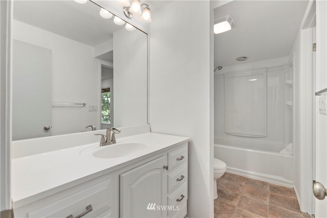 17335 159th Avenue Southeast Renton, WA 98058 - Photo 18 of 35 a bathroom with a sink double vanity and a mirror