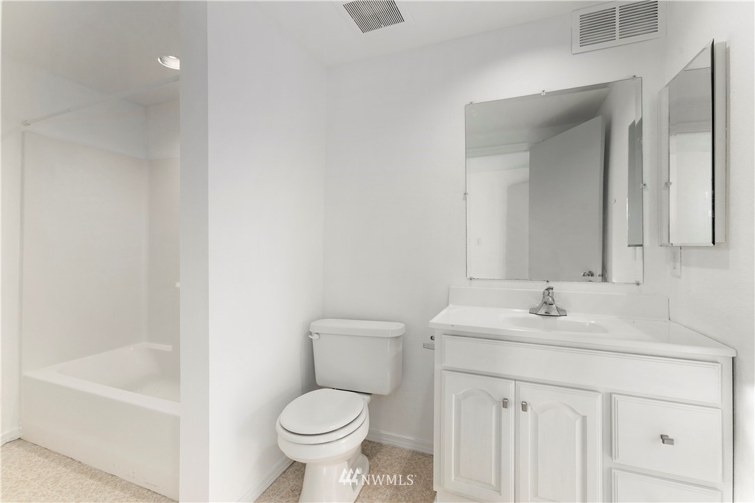 17335 159th Avenue Southeast Renton, WA 98058 - Photo 28 of 35 a bathroom with a sink toilet and shower