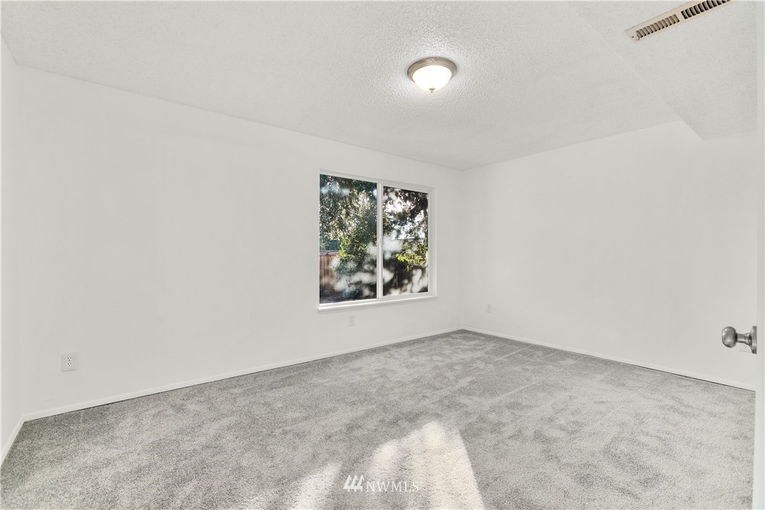17335 159th Avenue Southeast Renton, WA 98058 - Photo 31 of 35 an empty room with windows