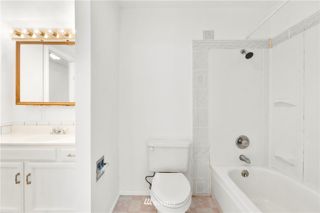 17335 159th Avenue Southeast Renton, WA 98058 - Photo 33 of 35 a bathroom with a bathtub shower sink vanity and toilet