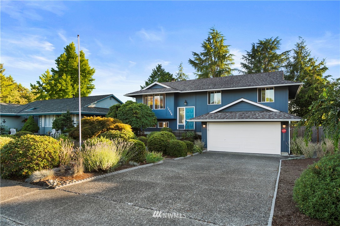 17335 159th Avenue Southeast Renton, WA 98058 - Photo 35 of 35 a front view of a house with a garden