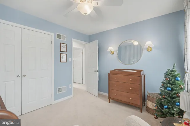 a room with a mirror and a lamp