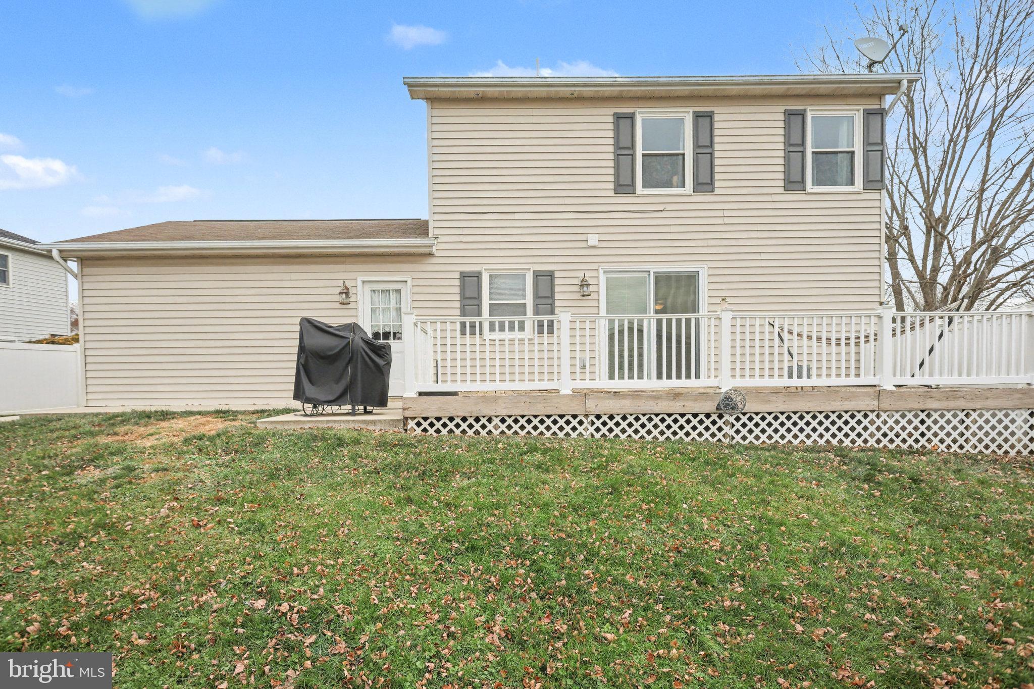 7 Meadow Lane Hanover, PA 17331 - Photo 25 of 31 a front view of a house with a yard and wooden fence