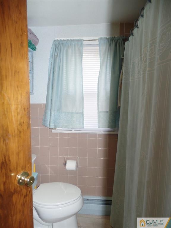 189 Midfield Road Colonia, NJ 07067 - Photo 16 of 16 a bathroom with a toilet and a shower