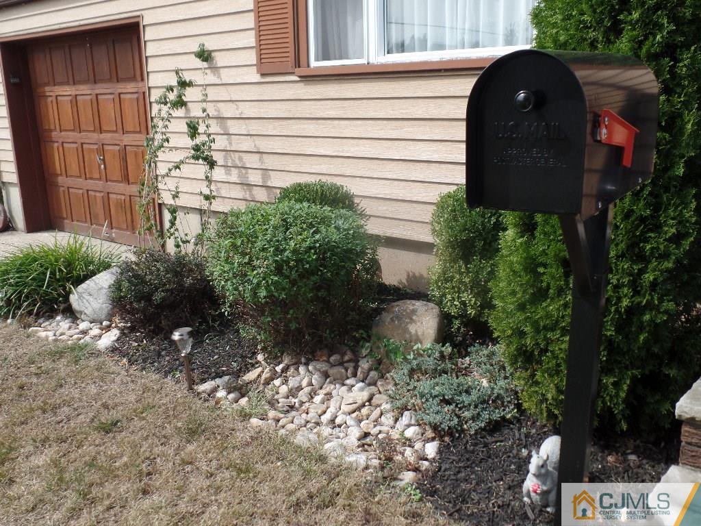 189 Midfield Road Colonia, NJ 07067 - Photo 3 of 16 a couple of flower plants in front of door