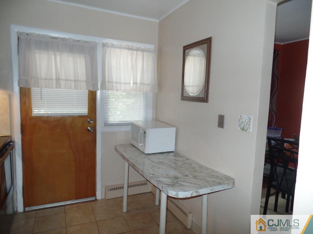 189 Midfield Road Colonia, NJ 07067 - Photo 7 of 16 a room with a table and workspace