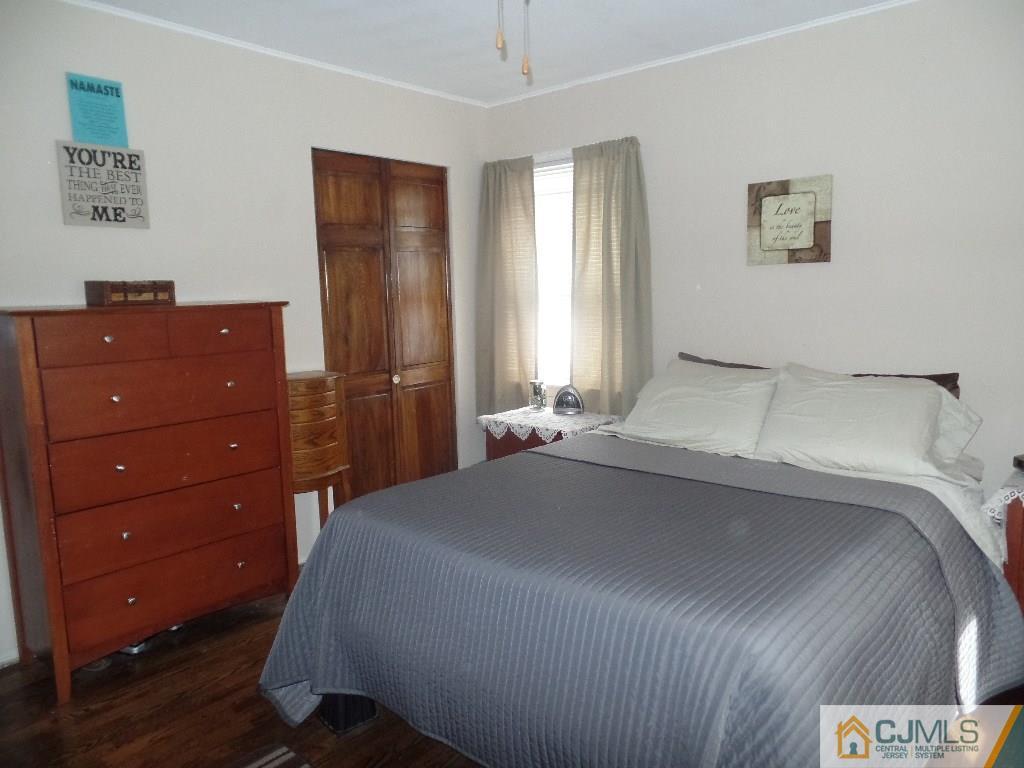 189 Midfield Road Colonia, NJ 07067 - Photo 10 of 16 a bedroom with a bed and a dresser