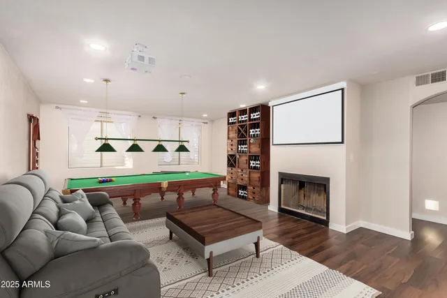 a view of a house with pool and sitting area