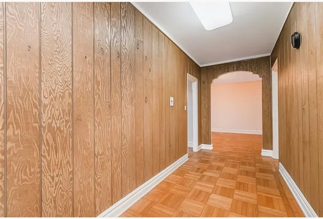 a view of a room with a wooden door