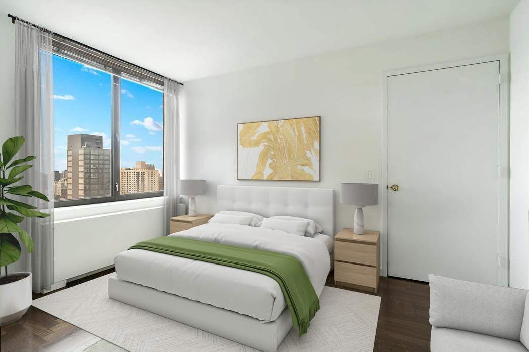 422 East 72nd Street, Unit 33A Manhattan, NY 10021 - Photo 10 of 18 a bedroom with a large bed and a large window