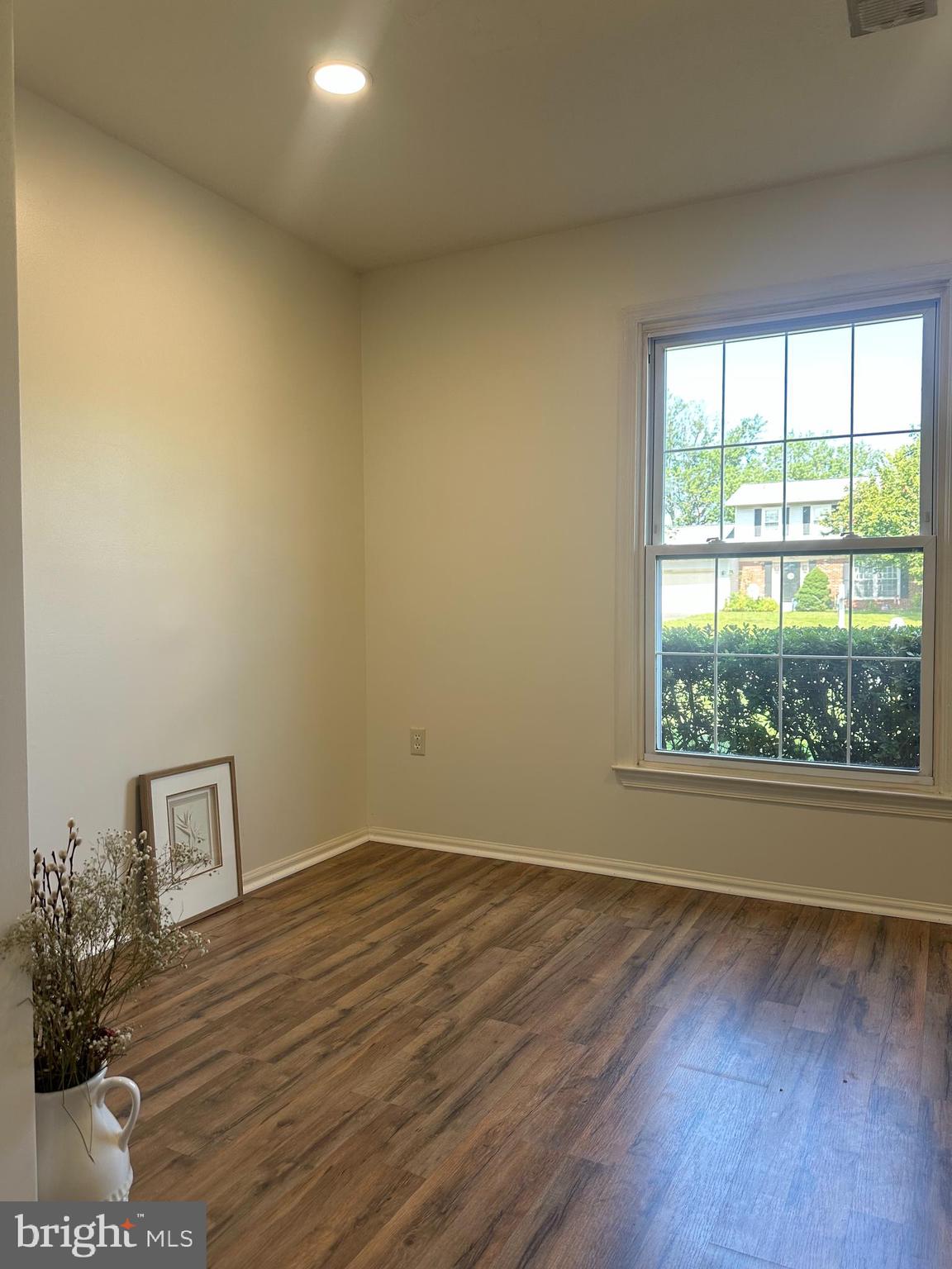 8959 Rolling Road Manassas, VA 20110 - Photo 54 of 80 a view of a room with wooden floor and a window