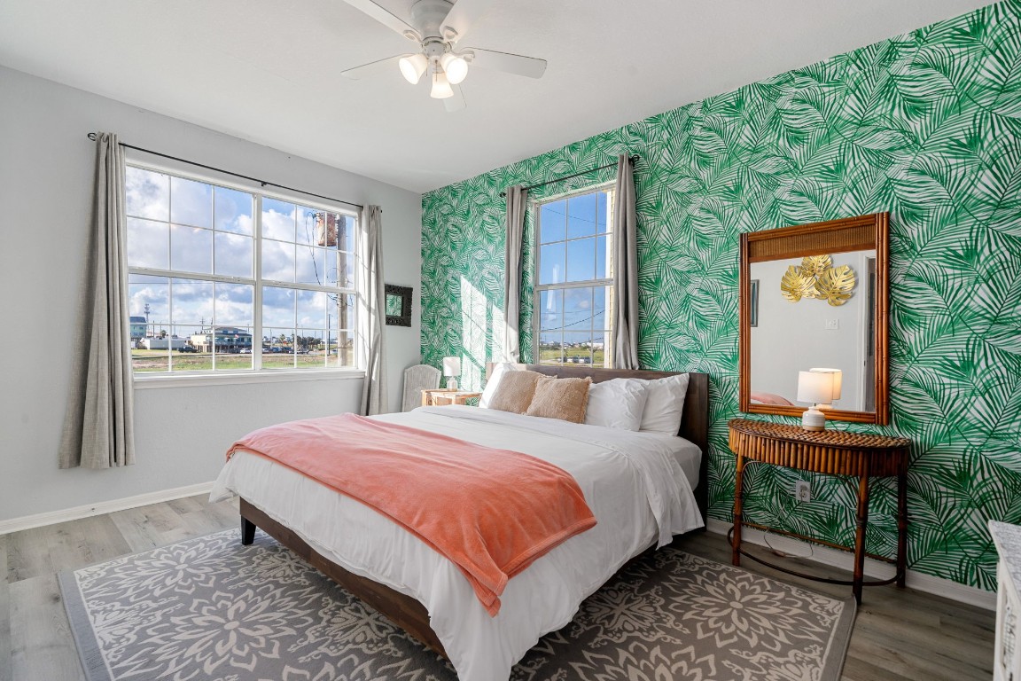 116 Starfish Street Surfside Beach, TX 77541 - Photo 21 of 49 a bedroom with a bed and a window